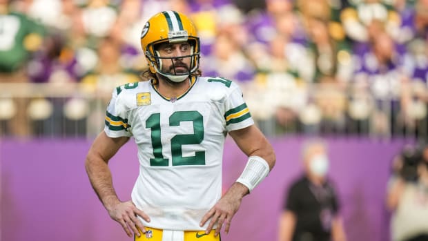 Nov 21, 2021; Minneapolis, Minnesota, USA; Green Bay Packers quarterback Aaron Rodgers (12) looks on during the second quarter against the Minnesota Vikings at U.S. Bank Stadium.