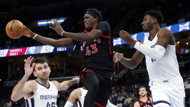 Nov 24, 2021; Memphis, Tennessee, USA; Toronto Raptors forward Pascal Siakam (43) passes the ball as Memphis Grizzles forward Jaren Jackson Jr. (13) defends during the first half at FedExForum. Mandatory Credit: Petre Thomas-USA TODAY Sports