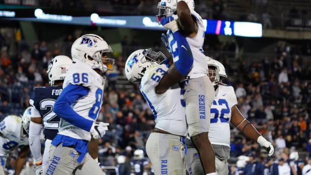 Oct 22, 2021; East Hartford, Connecticut, USA; Middle Tennessee Blue Raiders running back Martell Pettaway (32) is congratulated after scoring against the Connecticut Huskies in the second half at Rentschler Field at Pratt &amp; Whitney Stadium. Mandatory Credit: David Butler II-USA TODAY Sports