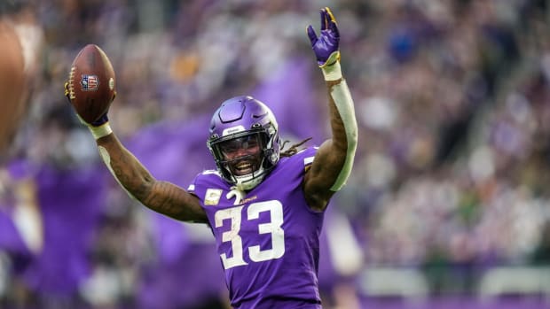 Nov 21, 2021; Minneapolis, Minnesota, USA; Minnesota Vikings running back Dalvin Cook (33) celebrates a two-point conversion during the fourth quarter against the Green Bay Packers at U.S. Bank Stadium. Mandatory Credit: Brace Hemmelgarn-USA TODAY Sports