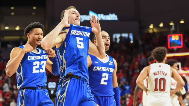 Nov 16, 2021; Lincoln, Nebraska, USA; Creighton Bluejays guard Alex O'Connell (5) and guard Trey Alexander (23) and guard Ryan Nembhard (2) react after the win against the Nebraska Cornhuskers at Pinnacle Bank Arena. Mandatory Credit: Steven Branscombe-USA TODAY Sports