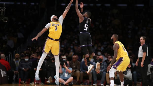 Nov 26, 2021; Los Angeles, California, USA; Los Angeles Lakers forward Anthony Davis (3) blocks a shot by Sacramento Kings guard De'Aaron Fox (5) during the second overtime at Staples Center. The Kings won 141-137 in triple-overtime. Mandatory Credit: Kiyoshi Mio-USA TODAY Sports