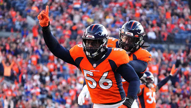 Denver Broncos inside linebacker Baron Browning (56) reacts to his tipped pass in the first quarter against the Los Angeles Chargers at Empower Field at Mile High.