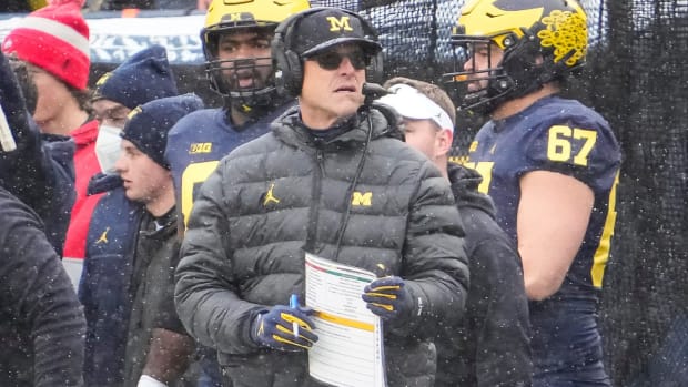 Michigan Wolverines head coach Jim Harbaugh stands on the sideline during the NCAA football game at Michigan Stadium in Ann Arbor on Monday, Nov. 29, 2021. Ohio State Buckeyes At Michigan Wolverines