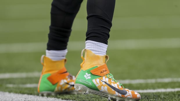 Dec 5, 2021; Cincinnati, Ohio, USA; The cleats of Cincinnati Bengals quarterback Joe Burrow (9) during warmups prior to the game against the Los Angeles Chargers at Paul Brown Stadium. Mandatory Credit: Katie Stratman-USA TODAY Sports