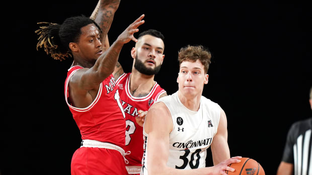 Cincinnati Bearcats forward Viktor Lakhin (30) looks to pass in the first half of an NCAA men's college basketball game against the Miami (Oh) Redhawks, Wednesday, Dec. 1, 2021, at Millett Hall in Oxford, Ohio. The Cincinnati Bearcats won, 59-58. Cincinnati Bearcats At Miami Oh Redhawks Dec 1