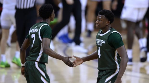 Mar 12, 2021; Las Vegas, Nevada, USA; Colorado State Rams guards Isaiah Stevens (4) and Kendle Moore (3) celebrate during a timeout against the Utah State Aggies during the first half at Thomas &amp; Mack Center. Mandatory Credit: Orlando Ramirez-USA TODAY Sports