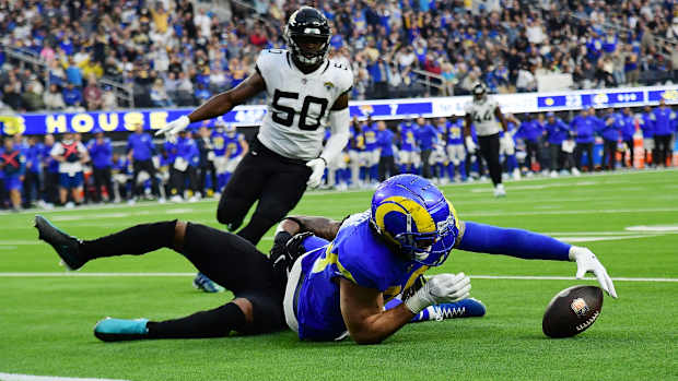 Dec 5, 2021; Inglewood, California, USA; Los Angeles Rams tight end Tyler Higbee (89) is brought down after a catch against the Jacksonville Jaguars during the second half at SoFi Stadium. Mandatory Credit: Gary A. Vasquez-USA TODAY Sports