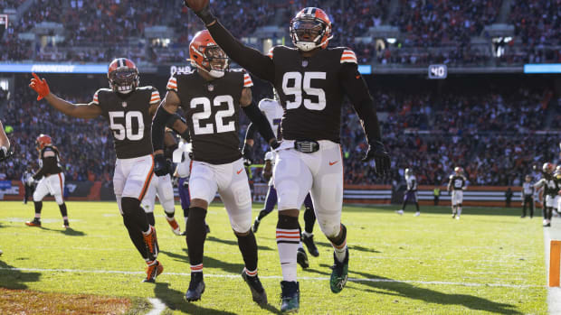 Dec 12, 2021; Cleveland, Ohio, USA; Cleveland Browns defensive end Myles Garrett (95) returns a fumble for a touchdown against the Baltimore Ravens during the second quarter at FirstEnergy Stadium. Mandatory Credit: Scott Galvin-USA TODAY Sports