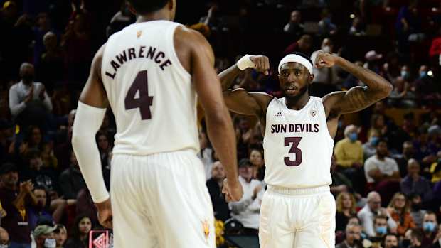 Dec 9, 2021; Tempe, Arizona, USA; Arizona State Sun Devils guard Marreon Jackson (3) and forward Kimani Lawrence (4) celebrate against the Grand Canyon Lopes during the second half at Desert Financial Arena. Mandatory Credit: Joe Camporeale-USA TODAY Sports