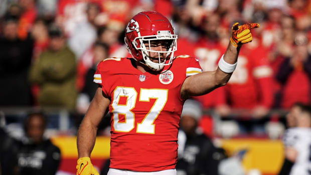 Dec 12, 2021; Kansas City, Missouri, USA; Kansas City Chiefs tight end Travis Kelce (87) celebrates after a first down against the Las Vegas Raiders during the first half at GEHA Field at Arrowhead Stadium. Mandatory Credit: Jay Biggerstaff-USA TODAY Sports