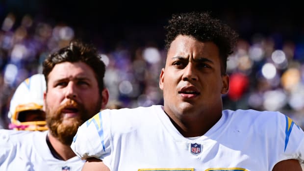 Oct 17, 2021; Baltimore, Maryland, USA; Los Angeles Chargers offensive tackle Rashawn Slater (70) stands on the sidelines during the first half against the Baltimore Ravens at M&T Bank Stadium. Mandatory Credit: Tommy Gilligan-USA TODAY Sports
