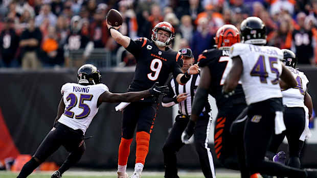 Cincinnati Bengals quarterback Joe Burrow (9) throws under pressure in the first quarter during a Week 16 NFL game against the Baltimore Ravens, Sunday, Dec. 26, 2021, at Paul Brown Stadium in Cincinnati.

Baltimore Ravens At Cincinnati Bengals Dec 26