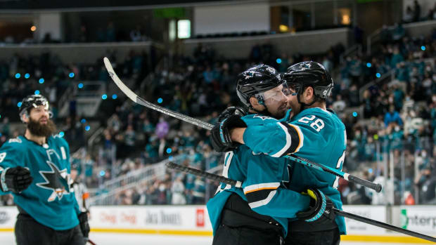 Dec 28, 2021; San Jose, California, USA; San Jose Sharks right wing Timo Meier (28) celebrates with center Logan Couture (39) after strong a goal against the Arizona Coyotes during the second period at SAP Center at San Jose. Mandatory Credit: John Hefti-USA TODAY Sports