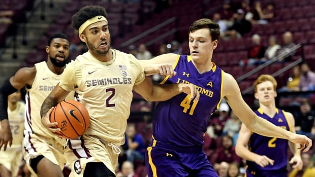 Dec 15, 2021; Tallahassee, Florida, USA; Florida State Seminoles guard Anthony Polite (2) drives past Lipscomb Bisons forward Jacob Ognacevic (41) during the first half at Donald L. Tucker Center. Mandatory Credit: Melina Myers-USA TODAY Sports