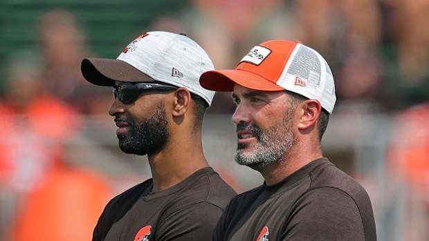 Cleveland Browns GM Andrew Berry, left, and head coach Kevin Stefanski watch the team practice during NFL football training camp, Saturday, July 31, 2021, in Berea, Ohio. Brownscamp31 5