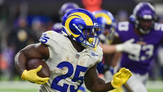 Dec 26, 2021; Minneapolis, Minnesota, USA; Los Angeles Rams running back Sony Michel (25) runs the ball against the Minnesota Vikings during the third quarter at U.S. Bank Stadium. Mandatory Credit: Jeffrey Becker-USA TODAY Sports