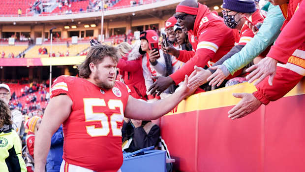 Dec 12, 2021; Kansas City, Missouri, USA; Kansas City Chiefs center Creed Humphrey (52) greets fans while leaving the field after the win over the Las Vegas Raiders at GEHA Field at Arrowhead Stadium. Mandatory Credit: Denny Medley-USA TODAY Sports