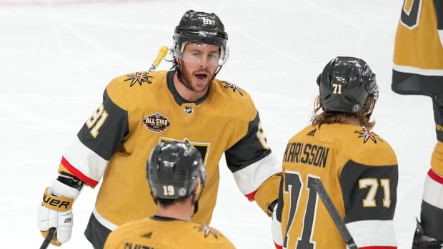 Jan 20, 2022; Las Vegas, Nevada, USA; Vegas Golden Knights center Jonathan Marchessault (81) celebrates with right wing Reilly Smith (19) and center William Karlsson (71) after scoring a goal against the Montreal Canadiens at T-Mobile Arena. Mandatory Credit: Stephen R. Sylvanie-USA TODAY Sports
