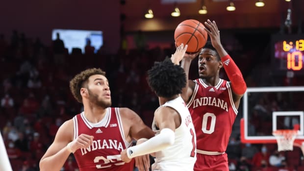 Jan 17, 2022; Lincoln, Nebraska, USA; Indiana Hoosiers guard Xavier Johnson (0) shoots the ball over Nebraska Cornhuskers guard Alonzo Verge Jr. (1) in the second half at Pinnacle Bank Arena. Mandatory Credit: Steven Branscombe-USA TODAY Sports