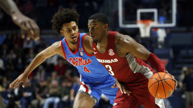 Arkansas Razorbacks forward Trey Wade (3) drives to the basket as Mississippi Rebels forward Jaemyn Brakefield (4) defends during the first half at The Sandy and John Black Pavilion at Ole Miss.