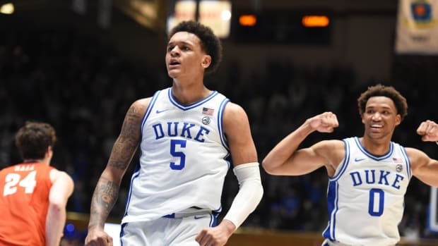 Jan 25, 2022; Durham, North Carolina, USA; Duke Blue Devils forwards Paolo Banchero (5) and Wendell Moore Jr. (0) react to a basket during the second half against the Clemson Tigers at Cameron Indoor Stadium. Mandatory Credit: Rob Kinnan-USA TODAY Sports