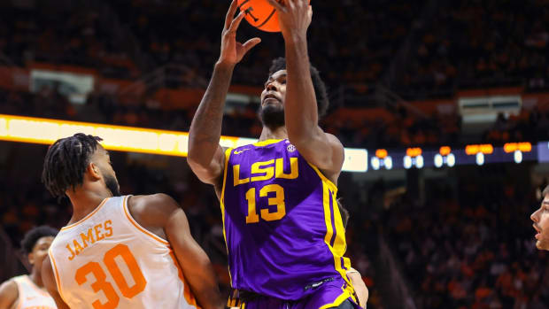 Jan 22, 2022; Knoxville, Tennessee, USA; LSU Tigers forward Tari Eason (13) drives to the basket against Tennessee Volunteers guard Josiah-Jordan James (30) during the first half at Thompson-Boling Arena. Mandatory Credit: Randy Sartin-USA TODAY Sports
