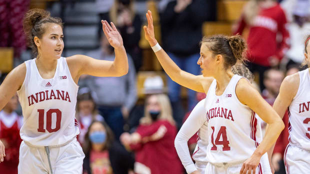 Indiana's Aleksa Gulbe and guard Ali Patberg high five