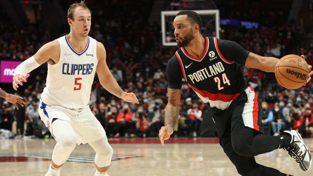 Portland Trail Blazers forward Norman Powell (24) drives on LA Clippers guard Luke Kennard (5) in the second half at Moda Center.