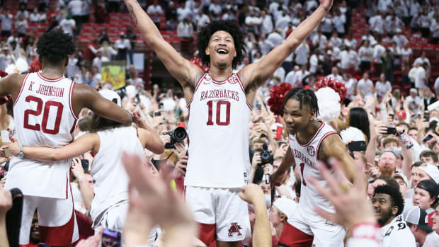 Arkansas Razorbacks forward Jaylin Williams (10) celebrates with teammates after the game against the Auburn Tigers at Bud Walton Arena. Arkansas won 80-76.