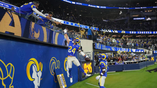 Dec 21, 2021; Inglewood, California, USA; Los Angeles Rams free safety Taylor Rapp (24) celebrates with fans after intercepting a pass against the Seattle Seahawks in the second half at SoFi Stadium. The Rams defeated the Seahawks 20-10. Mandatory Credit: Kirby Lee-USA TODAY Sports