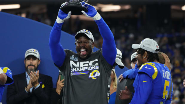 Jan 30, 2022; Inglewood, California, USA; Los Angeles Rams linebacker Von Miller hoists the George Halas Trophy after defeating the San Francisco 49ers in the NFC Championship Game at SoFi Stadium. Mandatory Credit: Kirby Lee-USA TODAY Sports