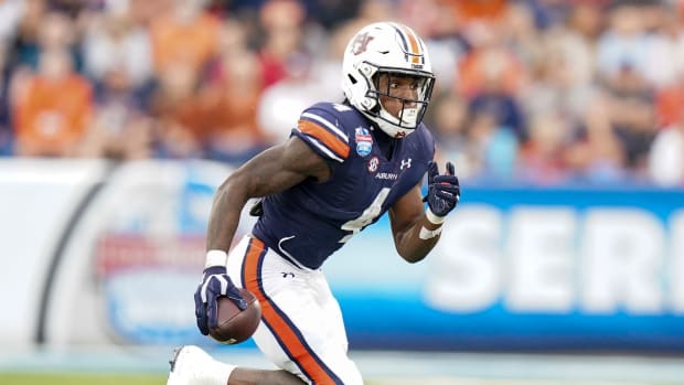 Dec 28, 2021; Birmingham, Alabama, USA; Auburn Tigers running back Tank Bigsby (4) carries the ball against Houston Cougars during the second half of the 2021 Birmingham Bowl at Protective Stadium. Mandatory Credit: Marvin Gentry-USA TODAY Sports
