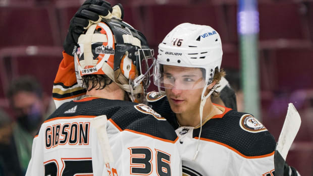 Feb 19, 2022; Vancouver, British Columbia, CAN; Anaheim Ducks goalie John Gibson (36) and forward Trevor Zegras (46) celebrate their victory over the Vancouver Canucks at Rogers Arena. Ducks won 7-4. Mandatory Credit: Bob Frid-USA TODAY Sports