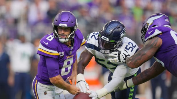 NFL: Seattle Seahawks at Minnesota Vikings Sep 26, 2021; Minneapolis, Minnesota, USA; Seattle Seahawks defensive end Darrell Taylor (52) strips Minnesota Vikings quarterback Kirk Cousins (8) in the third quarter at U.S. Bank Stadium.