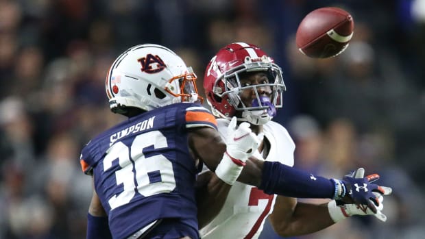 Nov 27, 2021; Auburn, Alabama, USA; Auburn Tigers defensive back Jaylin Simpson (36) breaks up a pass intended for Alabama Crimson Tide wide receiver Ja'Corey Brooks (7) at Jordan-Hare Stadium. Alabama defeated Auburn in four overtimes. Mandatory Credit: Gary Cosby Jr.-USA TODAY Sports