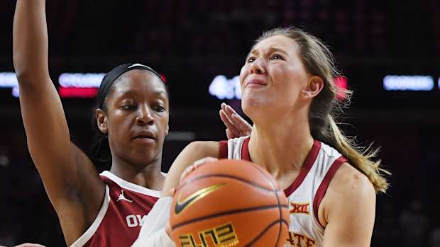 Iowa State Cyclones guard Ashley Joens (24) lays up the ball against Oklahoma Sooners guard Kennady Tucker (4) during the third quarter at Hilton Coliseum, Saturday, Feb. 19, 2022, in Ames, Iowa.