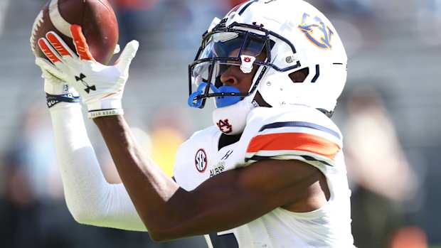 Oct 16, 2021; Fayetteville, Arkansas, USA; Auburn Tigers wide receiver Ja'Varrius Johnson (6) catches a pass for touchdown in the first quarter against the Arkansas Razorbacks at Donald W. Reynolds Razorback Stadium. Mandatory Credit: Nelson Chenault-USA TODAY Sports