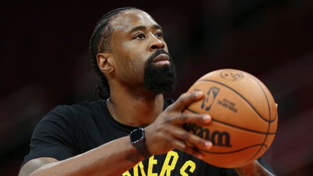Lakers center DeAndre Jordan warms up before a game against the Rockets.