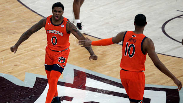 Mar 2, 2022; Starkville, Mississippi, USA; Auburn Tigers guard K.D. Johnson (0) reacts after a basket during the first half again the Mississippi State Bulldogs at Humphrey Coliseum. Mandatory Credit: Petre Thomas-USA TODAY Sports