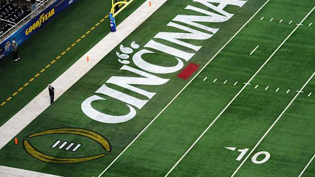 The Cincinnati Bearcats logo featured in the middle of the field ahead of the College Football Playoff semifinal game between the Alabama Crimson Tide and the Cincinnati Bearcats at the 86th Cotton Bowl Classic, Friday, Dec. 31, 2021, at AT&T Stadium in Arlington, Texas.