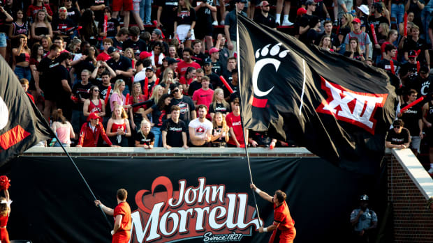 Cincinnati Bearcats Cheerleaders waive flags with the Big 12 logo in the second half of the NCAA football game between Cincinnati Bearcats and Murray State Racers on Saturday, Sept. 11, 2021, at Nippert Stadium in Cincinnati. Murray State Racers At Cincinnati Bearcats