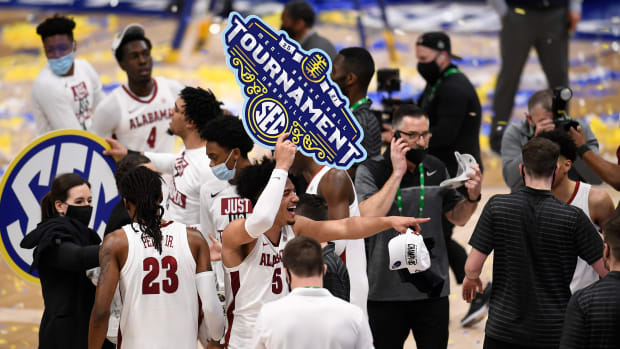 Alabama celebrates their 80 to 79 win against LSU in the SEC Men's Basketball Tournament Championship game at Bridgestone Arena Sunday, March 14, 2021 in Nashville, Tenn. Nas Sec Lsu Ala 05