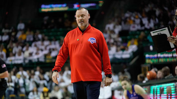 Feb 26, 2022; Waco, Texas, USA; Kansas Jayhawks head coach Brandon Schneider reacts to a call against the Baylor Lady Bears during the first half at Ferrell Center. Mandatory Credit: Chris Jones-USA TODAY Sports