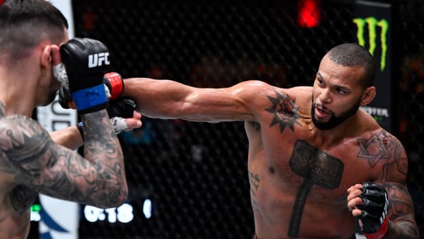Mar 6, 2021; Las Vegas, NV, USA; Thiago Santos of Brazil punches Aleksandar Rakic of Austria in their light heavyweight fight during the UFC 259 event at UFC APEX on March 06, 2021 in Las Vegas, Nevada.