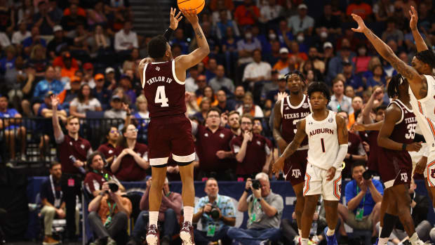Mar 11, 2022; Tampa, FL, USA; Texas A&M Aggies guard Wade Taylor IV (4) makes a three pointer against the Auburn Tigers during the second half at Amalie Arena. Mandatory Credit: Kim Klement-USA TODAY Sports