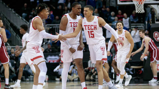 Mar 11, 2022; Kansas City, MO, USA; Texas Tech Red Raiders guard Kevin McCullar (15) slaps hands with Texas Tech Red Raiders guard Terrence Shannon Jr. (1) after the game against the Oklahoma Sooners at T-Mobile Center. Mandatory Credit: William Purnell-USA TODAY Sports
