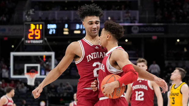 Indiana’s Trayce Jackson-Davis (23) reacts with Rob Phinisee during the first half of an NCAA college basketball game against Iowa in the semifinal round at the Big Ten Conference tournament, Saturday, March 12, 2022, in Indianapolis.