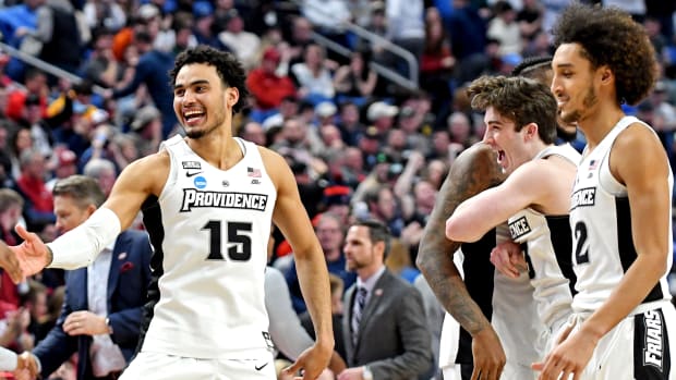 Mar 19, 2022; Buffalo, NY, USA; Providence Friars forward Justin Minaya (15) celebrates beating the Richmond Spiders during the second round of the 2022 NCAA Tournament at KeyBank Center. Mandatory Credit: Mark Konezny-USA TODAY Sports