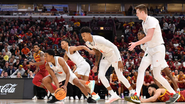 Mar 25, 2022; Chicago, IL, USA; Miami Hurricanes guard Charlie Moore (3) grabs a loose ball and heads up court during the second half against the Iowa State Cyclones in the semifinals of the Midwest regional of the men's college basketball NCAA Tournament at United Center. Mandatory Credit: Jamie Sabau-USA TODAY Sports